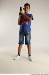 TIMBO STANDING POSE WITH GUN